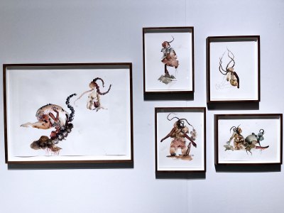 A grouping of five watercolors showing slightly abstracted figures.
