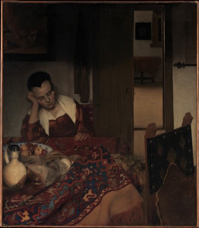 In a barely illuminated room, a young woman sleeps with an arm to her head, seated at a table upon which has been laid a bowl filled with fruit, a jug, and a red cloth. Another chair has been pulled out next to her. A door near her has been left open to reveal an adjacent room with no one in it.