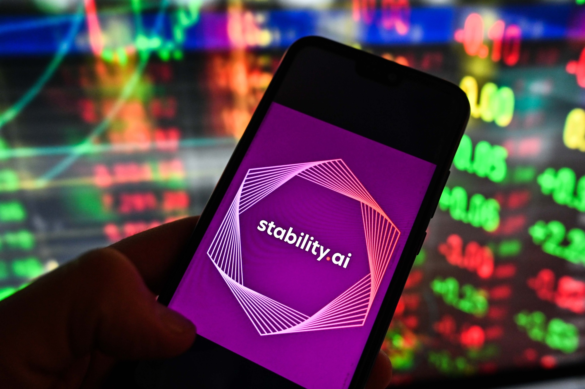 POLAND - 2023/01/20: In this photo illustration, the Stability.ai logo is displayed on a smartphone with stock market exchange in the background. (Photo Illustration by Omar Marques/SOPA Images/LightRocket via Getty Images)