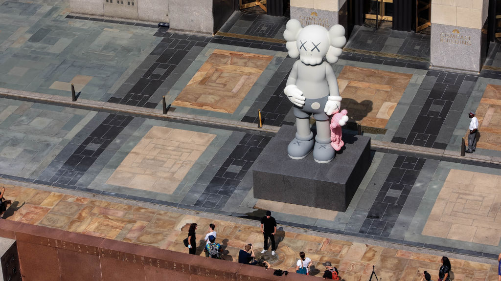 NEW YORK, NEW YORK - AUGUST 11:  Atmosphere at Artist KAWS Unveils His New Statue, Share, At Rockefeller Center on August 11, 2021 in New York City. (Photo by Jason Mendez/Getty Images)