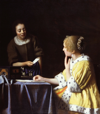 A white woman seated a table holds one hand to her face, which has a shocked expression. She wears a yellow jacket with a white fur trim. On the table is a letter that she is writing with her other hand. A white female maid comes in holding a piece of paper. They are pictured against a dark void.